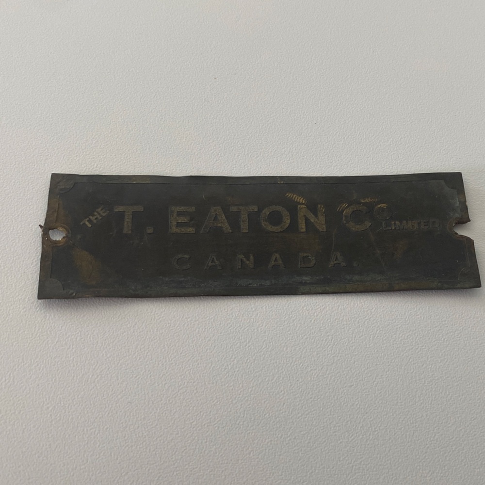 The T. Eaton Co. Canada Brass/Metal Tag - Dark Patina